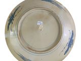 a blue and white plate on a white background