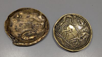 a close up of a coin with a picture of a man on it