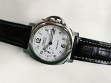 a close up of a wrist watch on a white surface