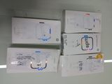 three boxes of wii remotes are stacked on top of each other