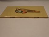 a yellow book with a picture of a man holding a baseball bat