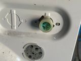 a close up of a white toilet with the lid down