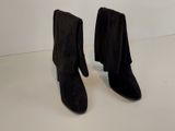 bottines noires en daim avec des pompons sur le côté