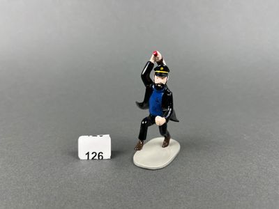toy figurine of a man in a blue shirt and black pants holding a baseball bat