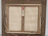 an old picture frame with a rope hanging from it ' s side