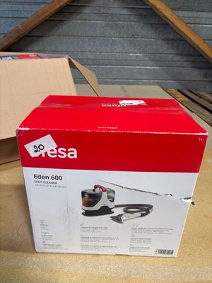 the box of a vacuum cleaner is sitting on a table