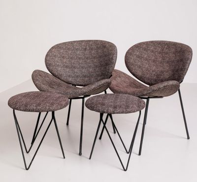 three chairs and a stool in a room with a white background
