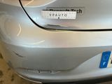 a picture of a car with a sticker on it ' s bumper
