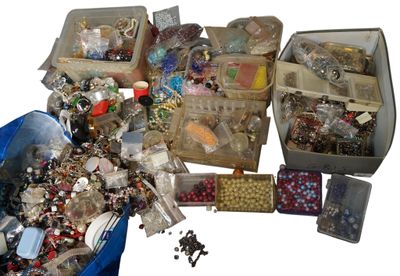 many different types of jewelry in the bins on the table
