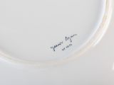 a close up of a plate with writing on it