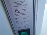a close up of a sign on the side of a refrigerator