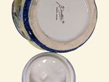 an image of a jar of cream with a lid