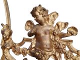an antique brass figurine of a cupid holding a flower