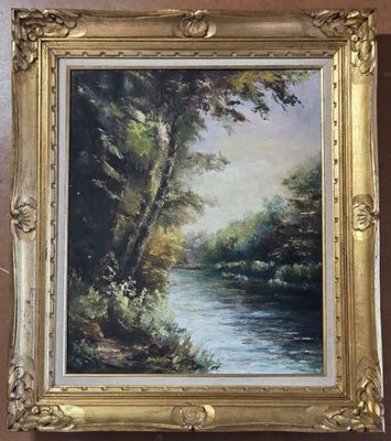 an oil painting of a river in a golden frame hanging on a wall