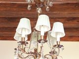 a chandelier hanging from the ceiling in a room