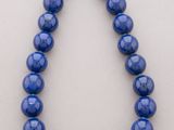a blue beaded necklace with a gold clasp