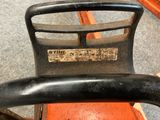 a close up of a black and orange chair in a room