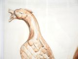 a painting of a bird that is on the wall