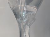 a wine glass that is sitting on top of a table