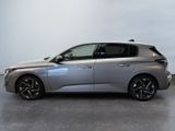 the silver car is parked on the concrete floor in the room