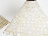 pair of lamps with mother of pearl lampshads on a black metal stand
