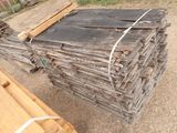 several pieces of wood are stacked on top of each other in a pile
