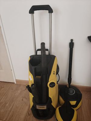 two yellow and black vacuum cleaners sitting on the floor next to each other