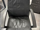 black leather office chair with footstop and foot rest