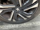a close up of a car ' s tire on the street