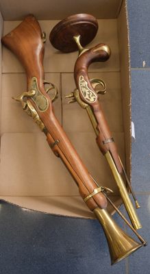 a box that has two different types of guns in it