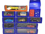 many toy cars in a blue box on a white background