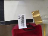 a label on a piece of luggage that is sitting on a table