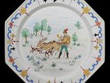 une assiette avec l'image d'un homme et d'un chien
