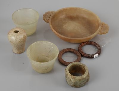 several pieces of pottery sitting on top of a table next to each other