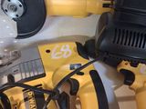 two electric tools that are sitting on a shelf