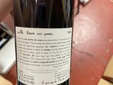 a bottle of wine that is being held by a person