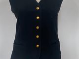 black vest with gold buttons on a mannequin torso