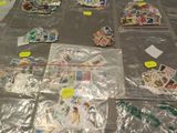 many different types of stamps laid out on the floor