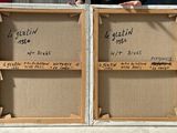 a man standing next to two wooden boxes with writing on them