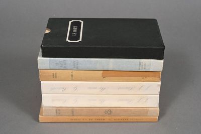 several books stacked on top of each other on a table