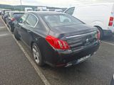 a black car that is parked in a parking lot