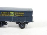 a toy truck that is sitting on a white surface