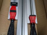 two red and black tools in a cardboard box