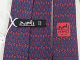 a tie with a label on it that says hermes