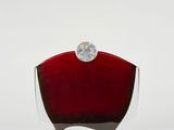 an image of a red glass vase with a diamond on top