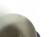 a white plate with a blue and white design on it