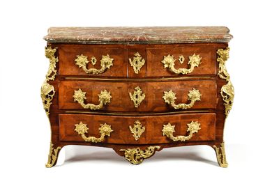 a small chest of drawers with a marble top