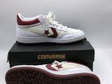 a pair of converses are on top of a box