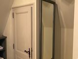 a bathroom with a sink and a mirror in it