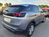 the rear end of a silver suv parked in a parking lot